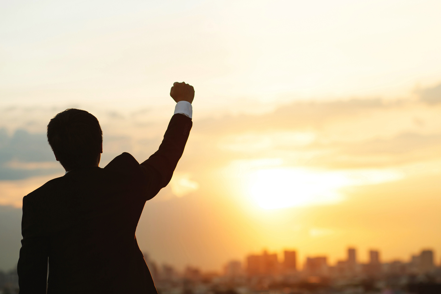 Successful Businessman Raising His Hand      
